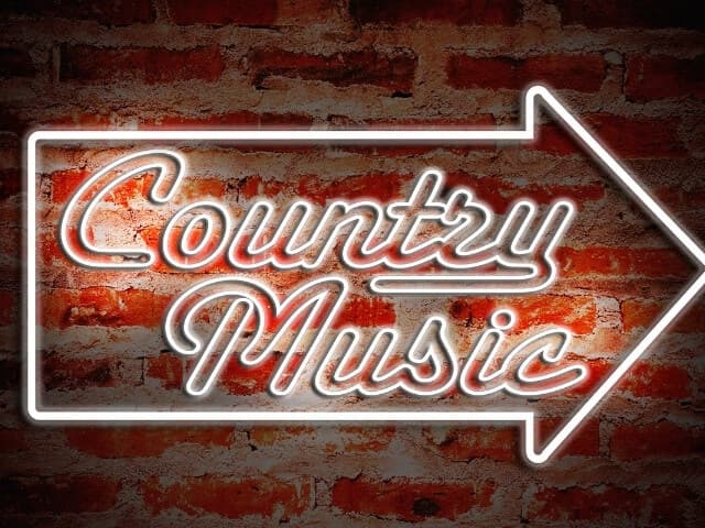 fotografia de um letreiro escrito musica country